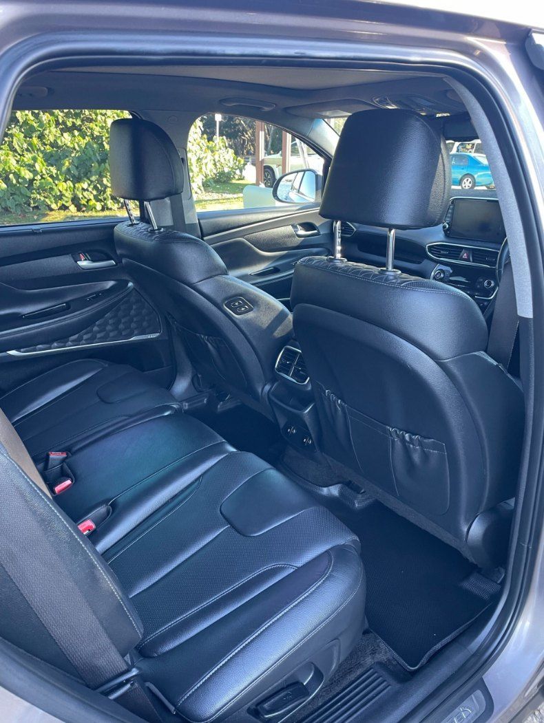 The Back Seat of a Car With Black Leather Seats — Pelican Motors Service Centre In Caloundra West, QLD