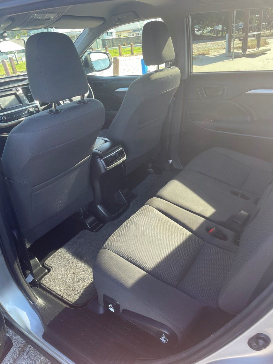 The Back Seat of a Car is Shown With the Door Open โ Pelican Motors Service Centre In Caloundra West, QLD