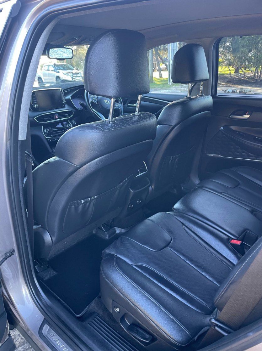 The Back Seat of a Car With Black Leather Seats — Pelican Motors Service Centre In Caloundra West, QLD