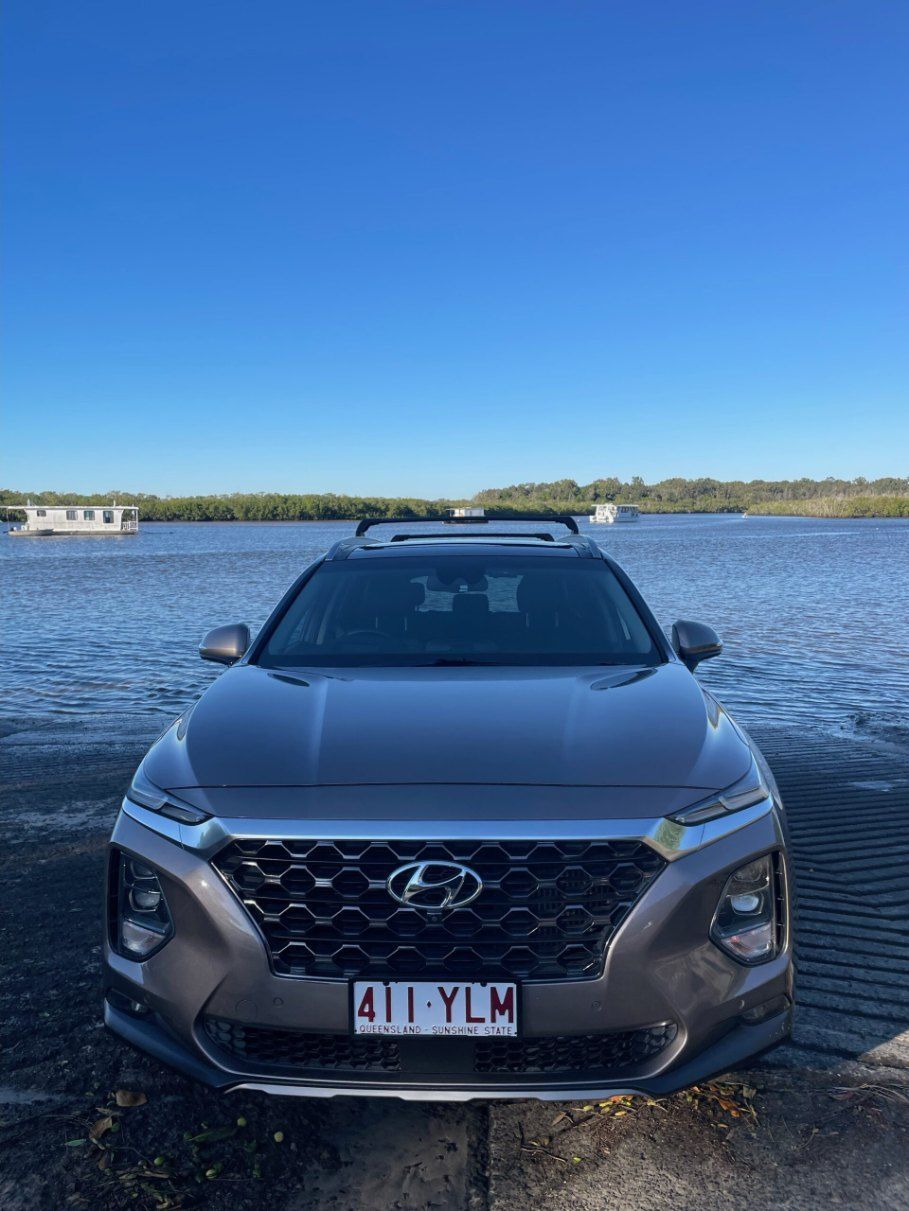 A Hyundai Santa Fe is Parked Next to a Body of Water — Pelican Motors Service Centre In Caloundra West, QLD