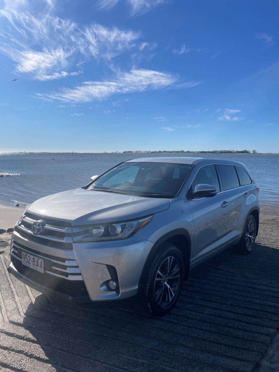 A Silver Toyota Highlander is Parked Next to a Body of Water โ Pelican Motors Service Centre In Caloundra West, QLD