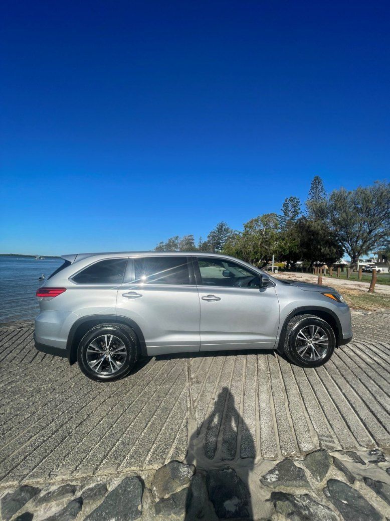 A Silver Car is Parked on the Beach Next to a Body of Water โ Pelican Motors Service Centre In Caloundra West, QLD