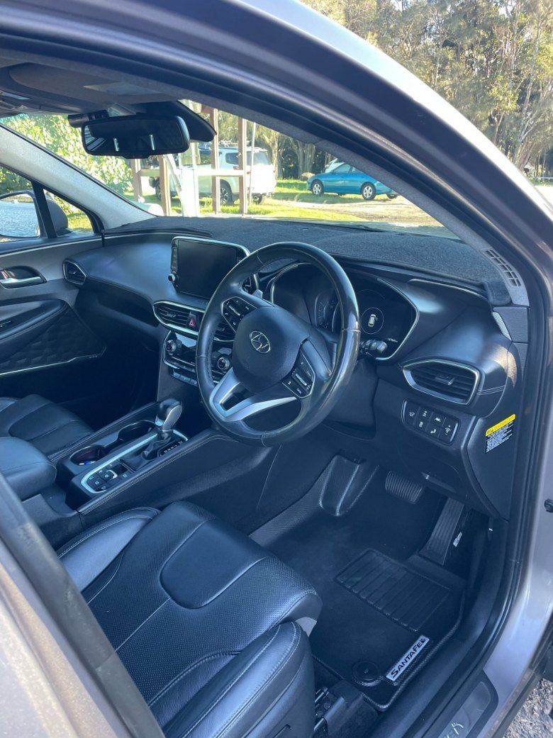 The Interior of a Hyundai Santa Fe is Shown With the Door Open — Pelican Motors Service Centre In Caloundra West, QLD