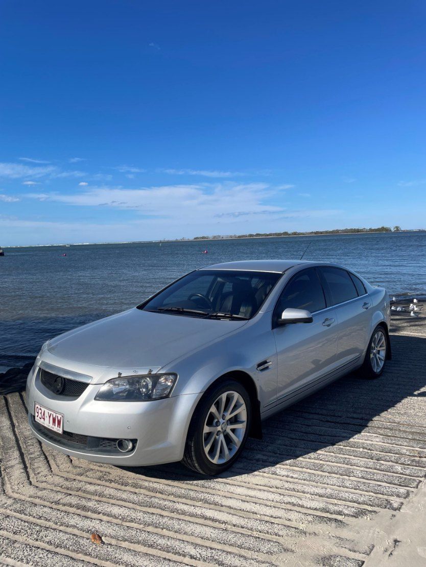 A Silver Car is Parked on a Dock Next to the Ocean β Pelican Motors Service Centre In Caloundra West, QLDΒ