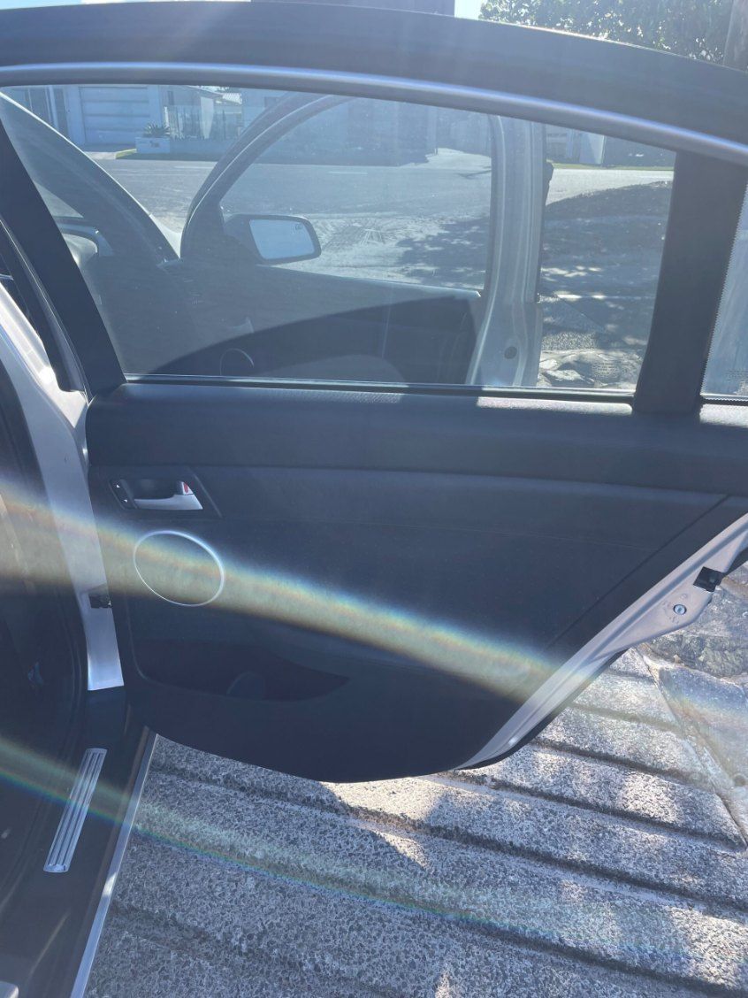 A Car With the Door Open is Parked on the Side of the Road β Pelican Motors Service Centre In Caloundra West, QLD