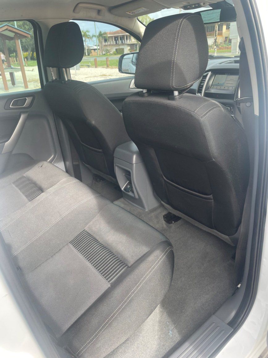 The Back Seat of a White Car With Black Seats β Pelican Motors Service Centre In Caloundra West, QLD
