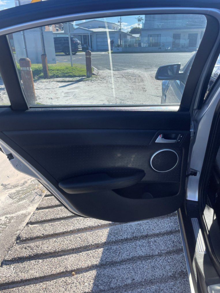A Car is Parked in a Parking Lot With the Door Open β Pelican Motors Service Centre In Caloundra West, QLD