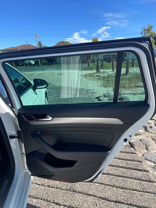 The Back Door of a White Car is Open โ Pelican Motors Service Centre In Caloundra West, QLD