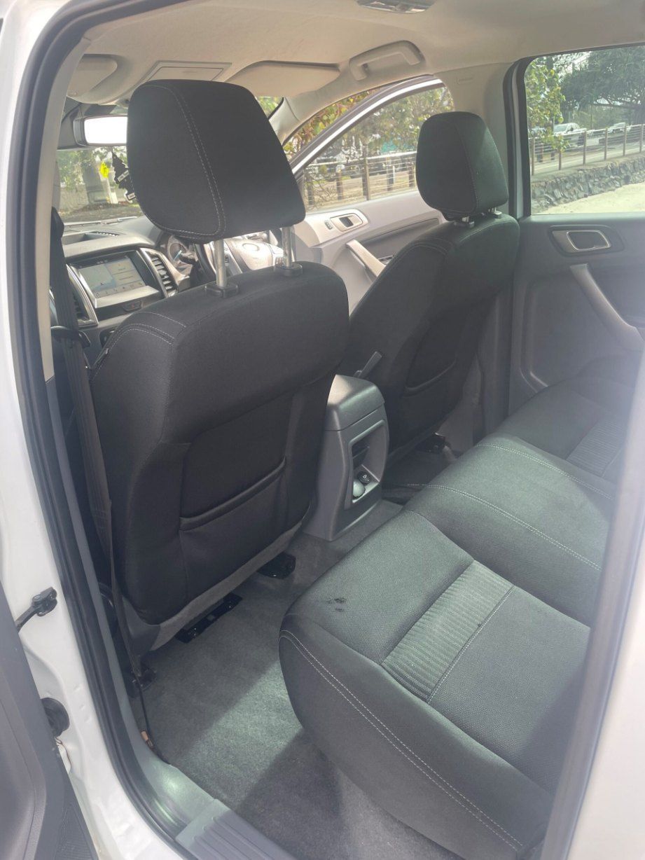 The Back Seat of a White Truck With Black Seats β Pelican Motors Service Centre In Caloundra West, QLD