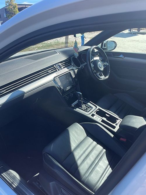 The Interior of a White Car With Black Seats and a Steering Wheel โ Pelican Motors Service Centre In Caloundra West, QLD