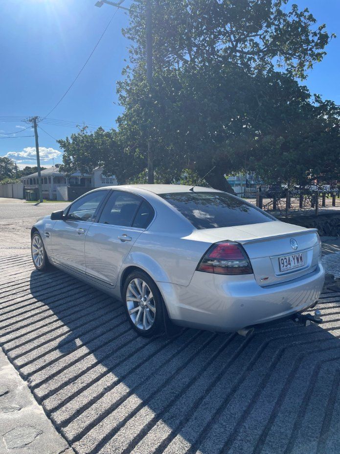 A Silver Car is Parked in a Parking Lot Next to a Tree β Pelican Motors Service Centre In Caloundra West, QLD