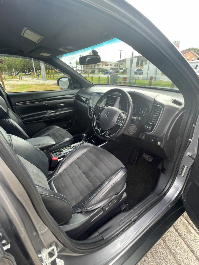 The Interior of a Black Car With the Door Open — Pelican Motors Service Centre In Caloundra West, QLD