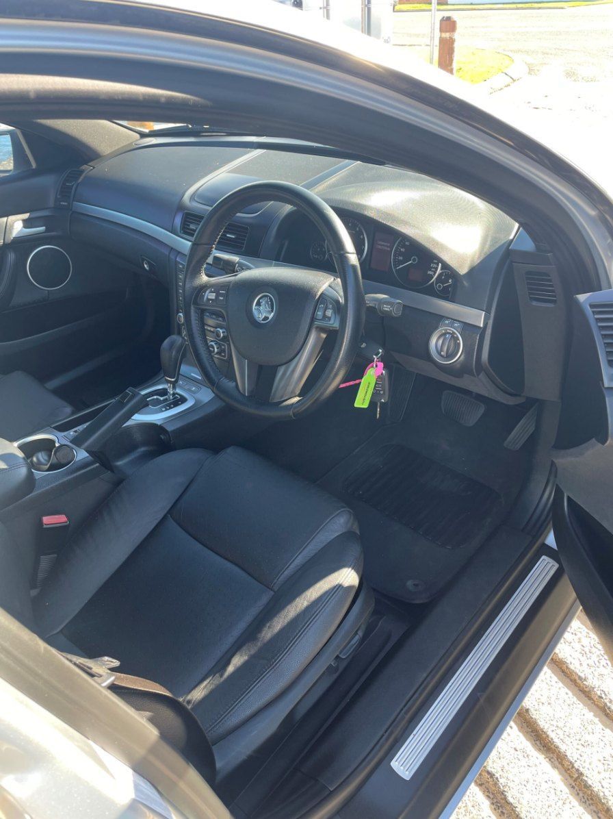 The Interior of a Car With the Door Open and the Steering Wheel Visible β Pelican Motors Service Centre In Caloundra West, QLD