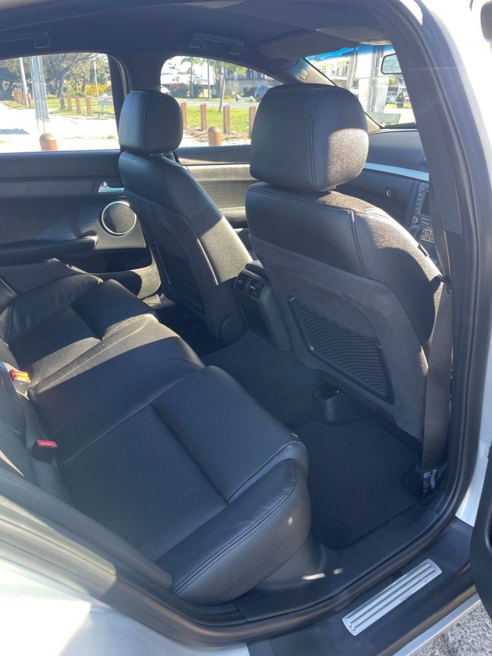 The Back Seat of a White Car With Black Leather Seats β Pelican Motors Service Centre In Caloundra West, QLD