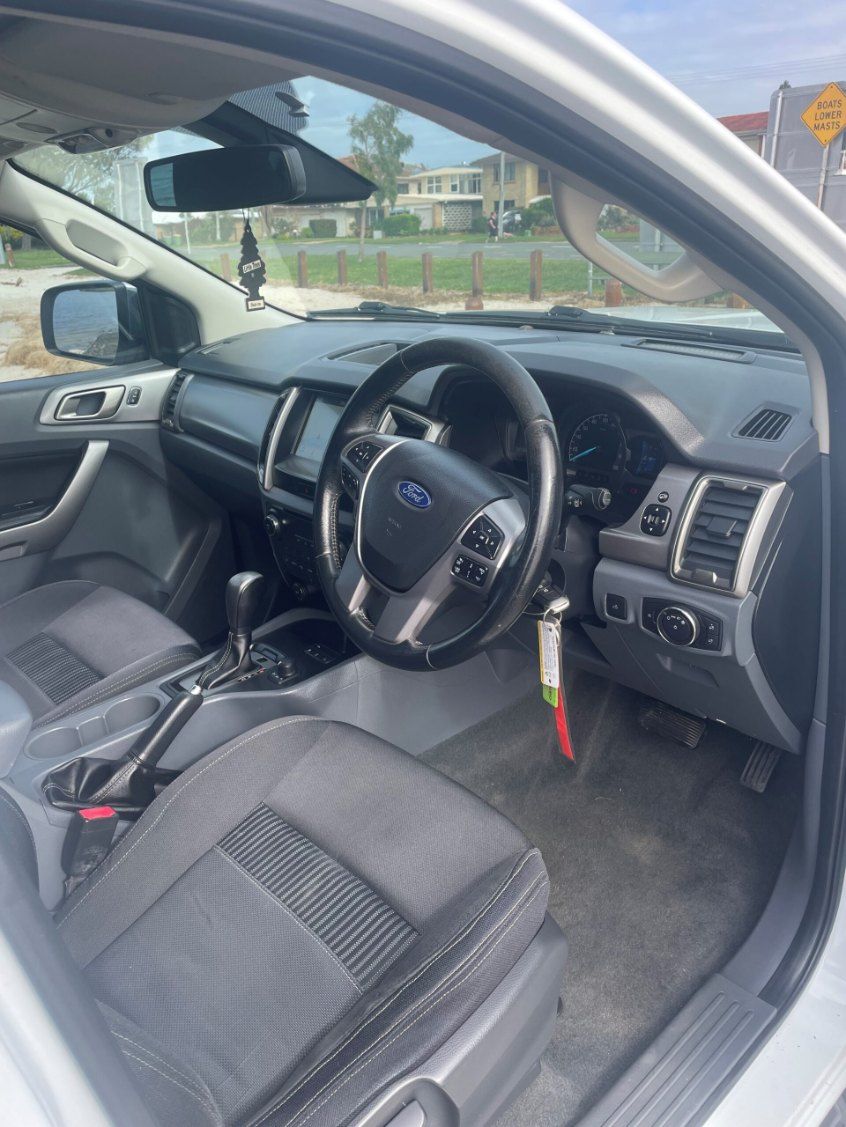 The Interior of a White Ford Ranger is Shown With the Door Open β Pelican Motors Service Centre In Caloundra West, QLD
