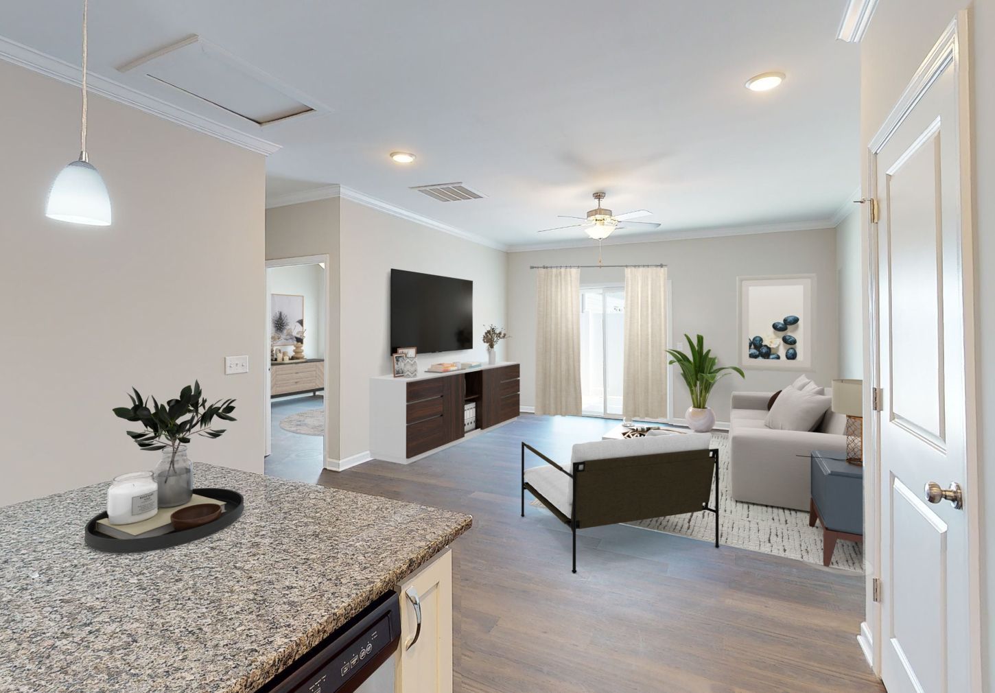 A kitchen with white cabinets , stainless steel appliances and granite counter tops.