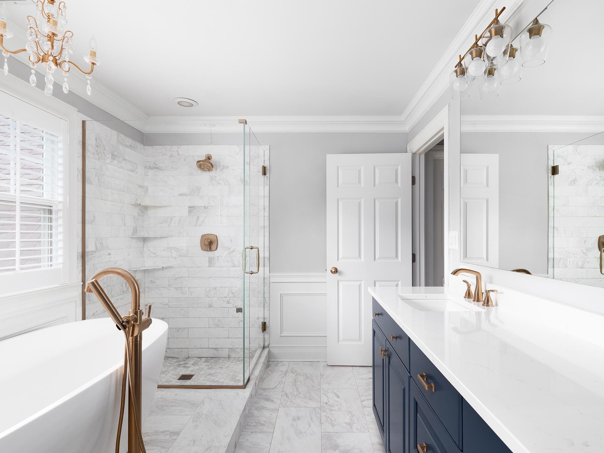 Bright modern bathroom with a freestanding tub and glass shower. Bright modern bathroom with a freestanding tub and glass shower.