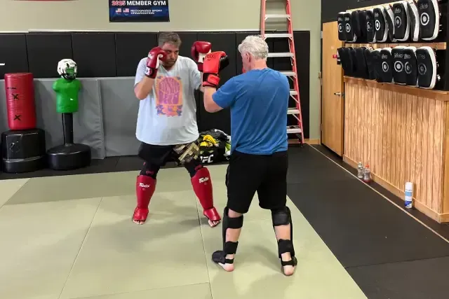 Amr Ibrahim teaching elbow technique in class