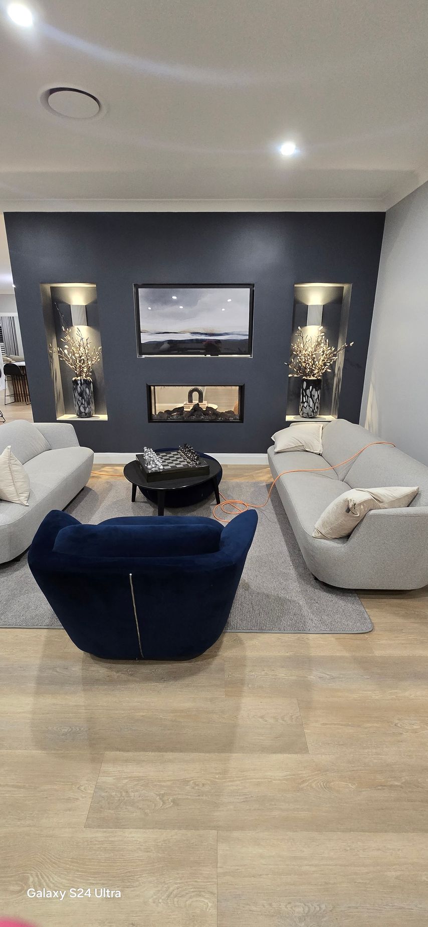 An entertainment area with fire place and cheese board— A Place 2 Shine In Maitland, NSW