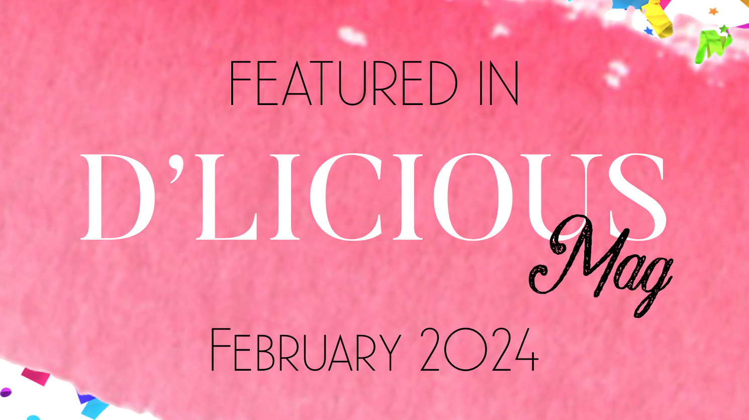 A pink sign that says ' featured in d ' licious mag ' on it