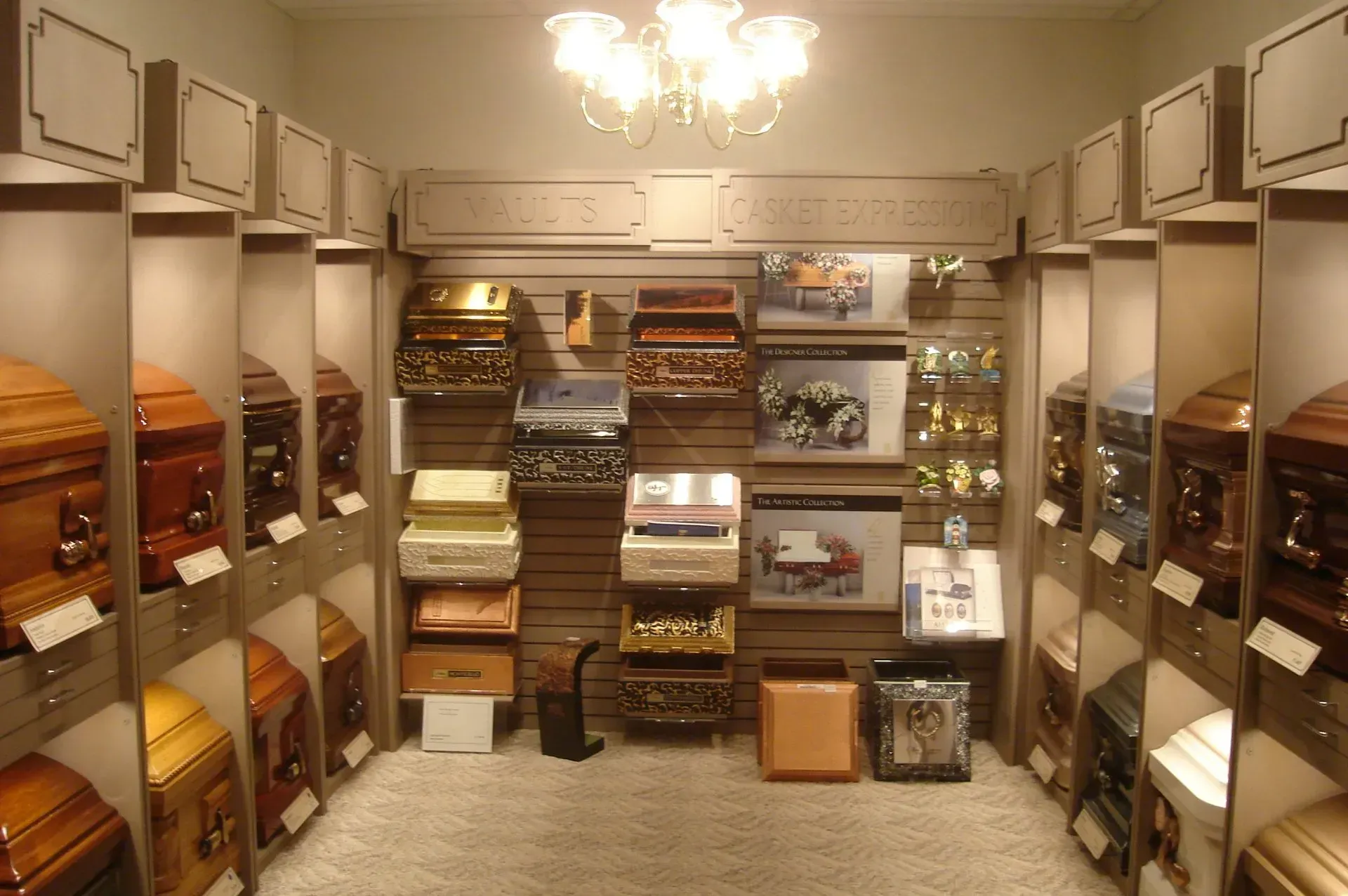 A room filled with lots of coffins and pictures