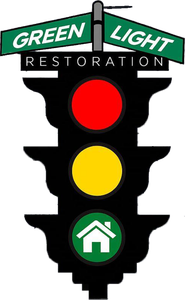 Green Light Restoration logo with a traffic light showing red, yellow, and green home icon lights
