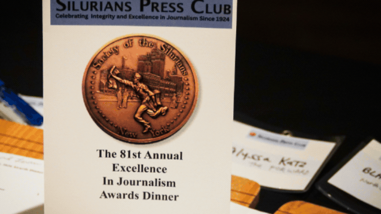 Silurians Press Club brochure on a table for the 81st Annual Excellence in Journalism Awards Dinner