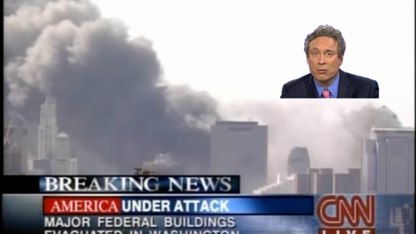 CNN live breaking news: smoke rises from World Trade Center towers after attack; “America under attack” banner.