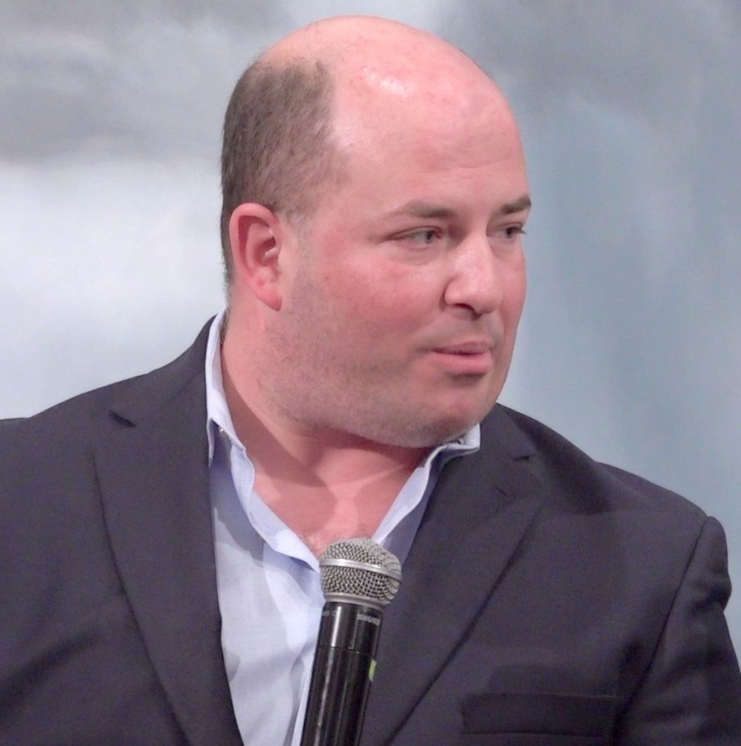 Brians Stelter at Silurians March 19 luncheon, wearing a sports jacket