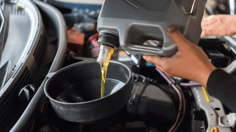a mobile mechanics doing an at home oil change