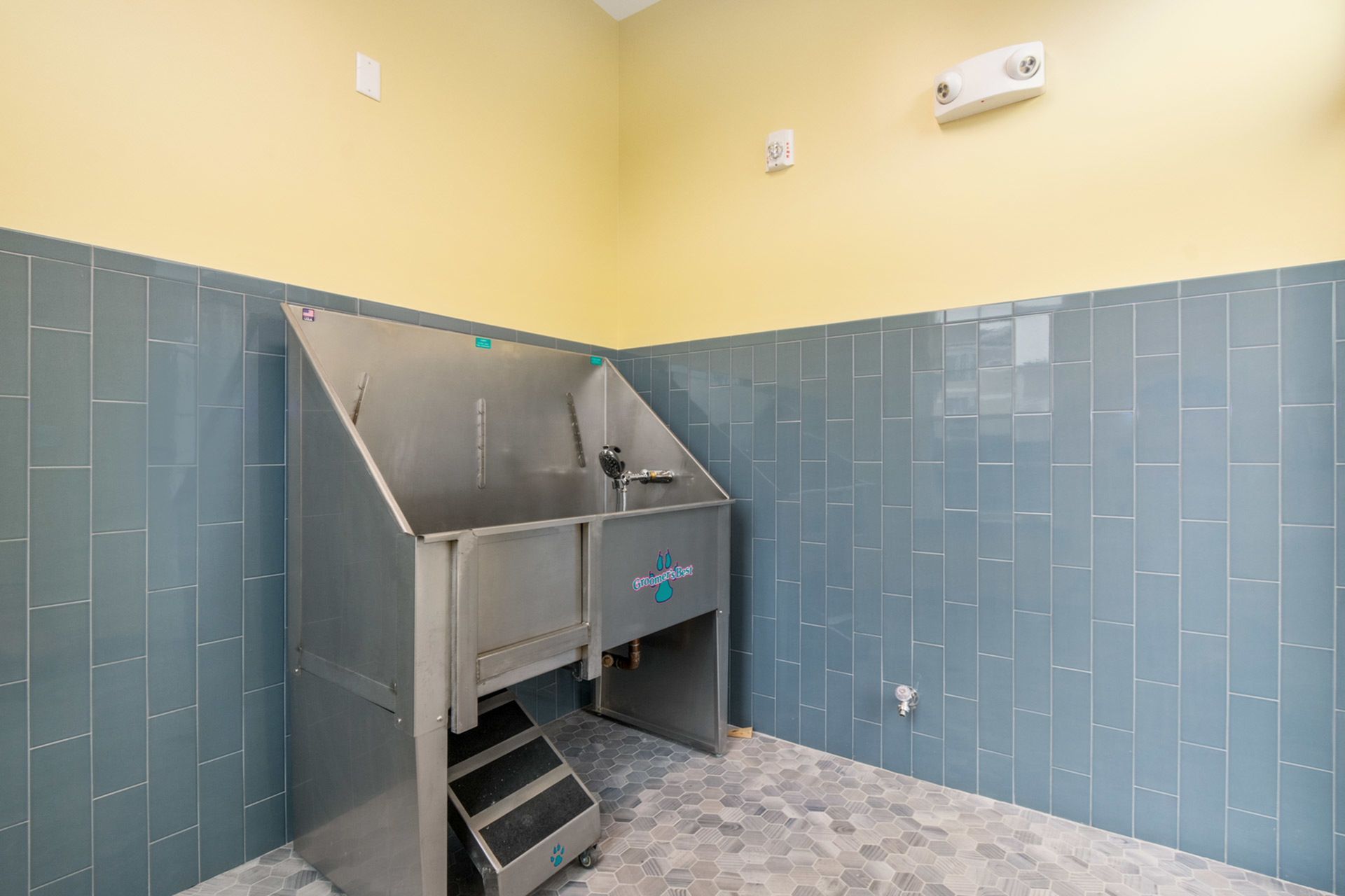 Gradient apartment community pet wash station.