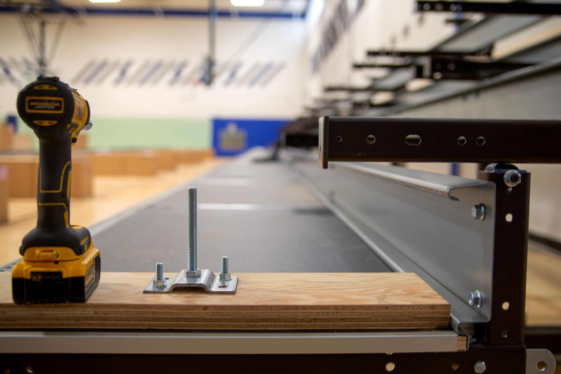 Photo of a drill on a bleacher in process at a KSSG installation site.