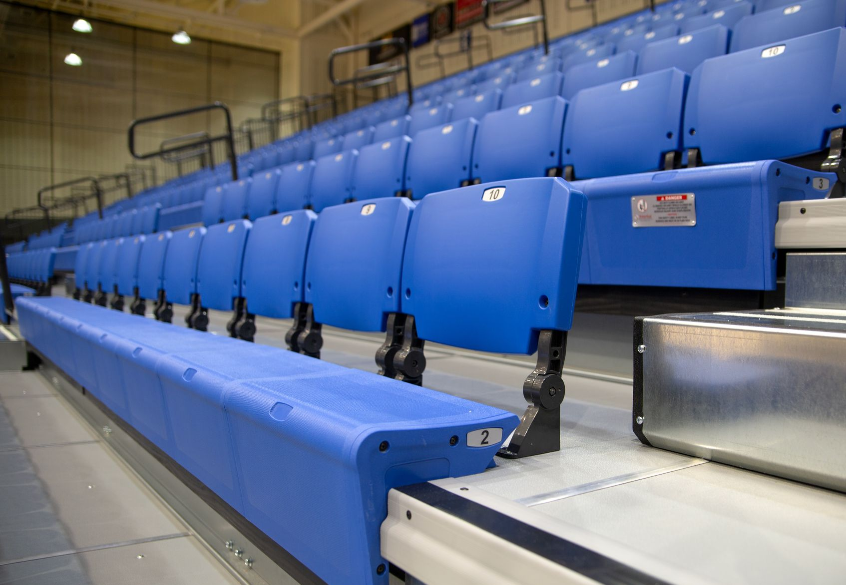 Grand Valley State University telescopic bleachers featuring EXCEL Seat Modules with ComfoBack Backrests, both in Royal Blue.