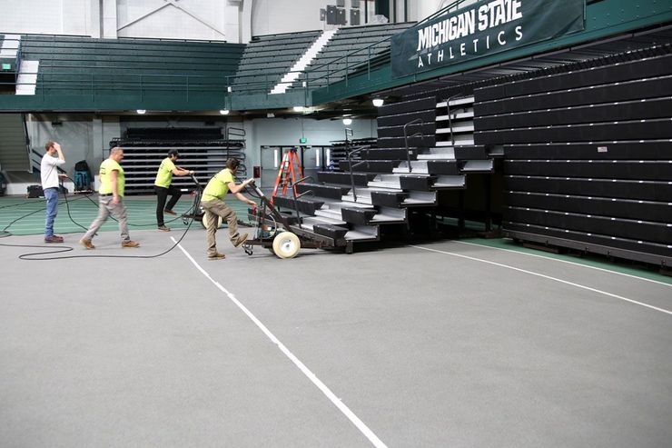 The staff of Kalamazoo Seating Service Group on location at Jenison Fieldhouse at Michigan State University.