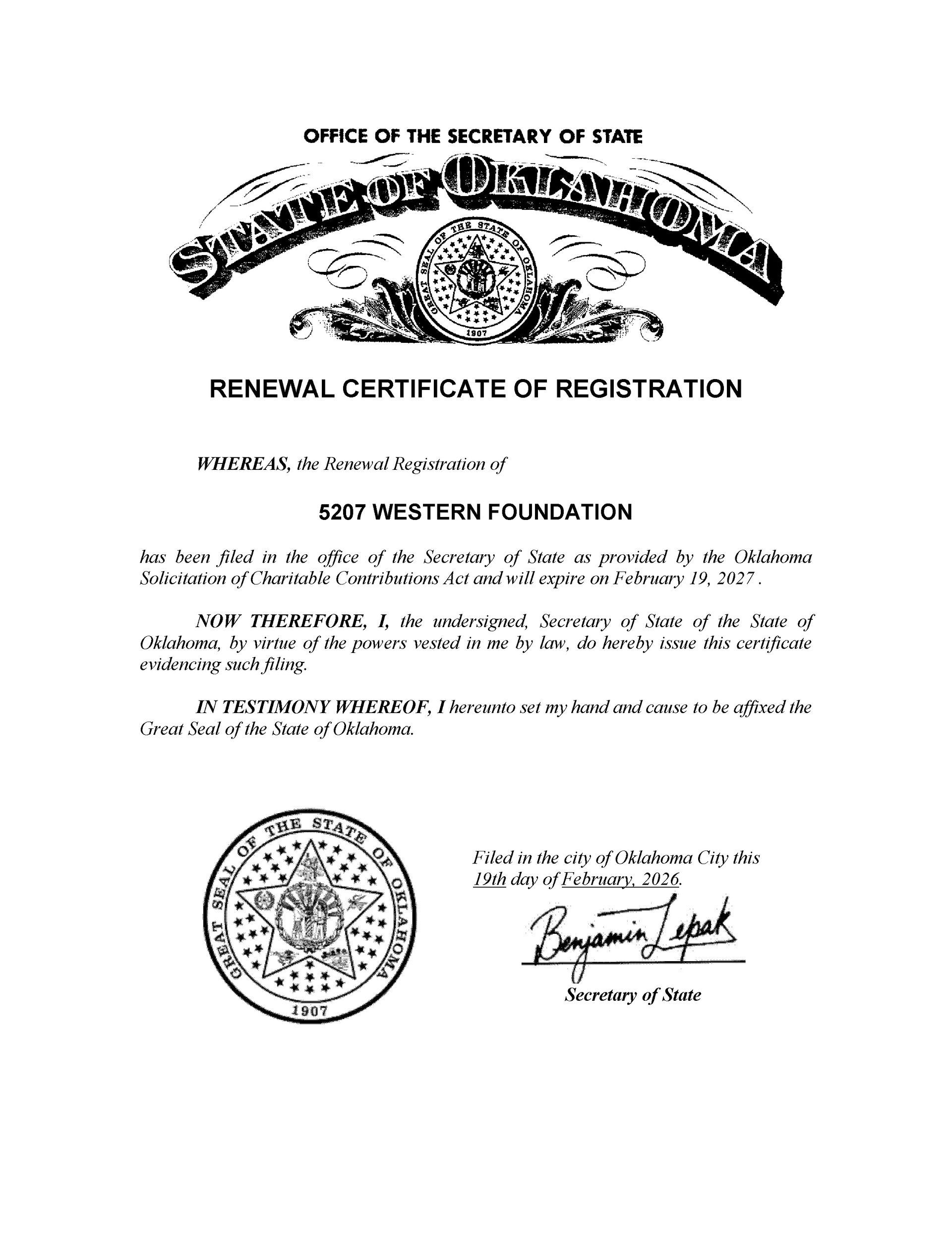 Scanned official certificate with decorative header, text blocks, seal, and signature on white paper.