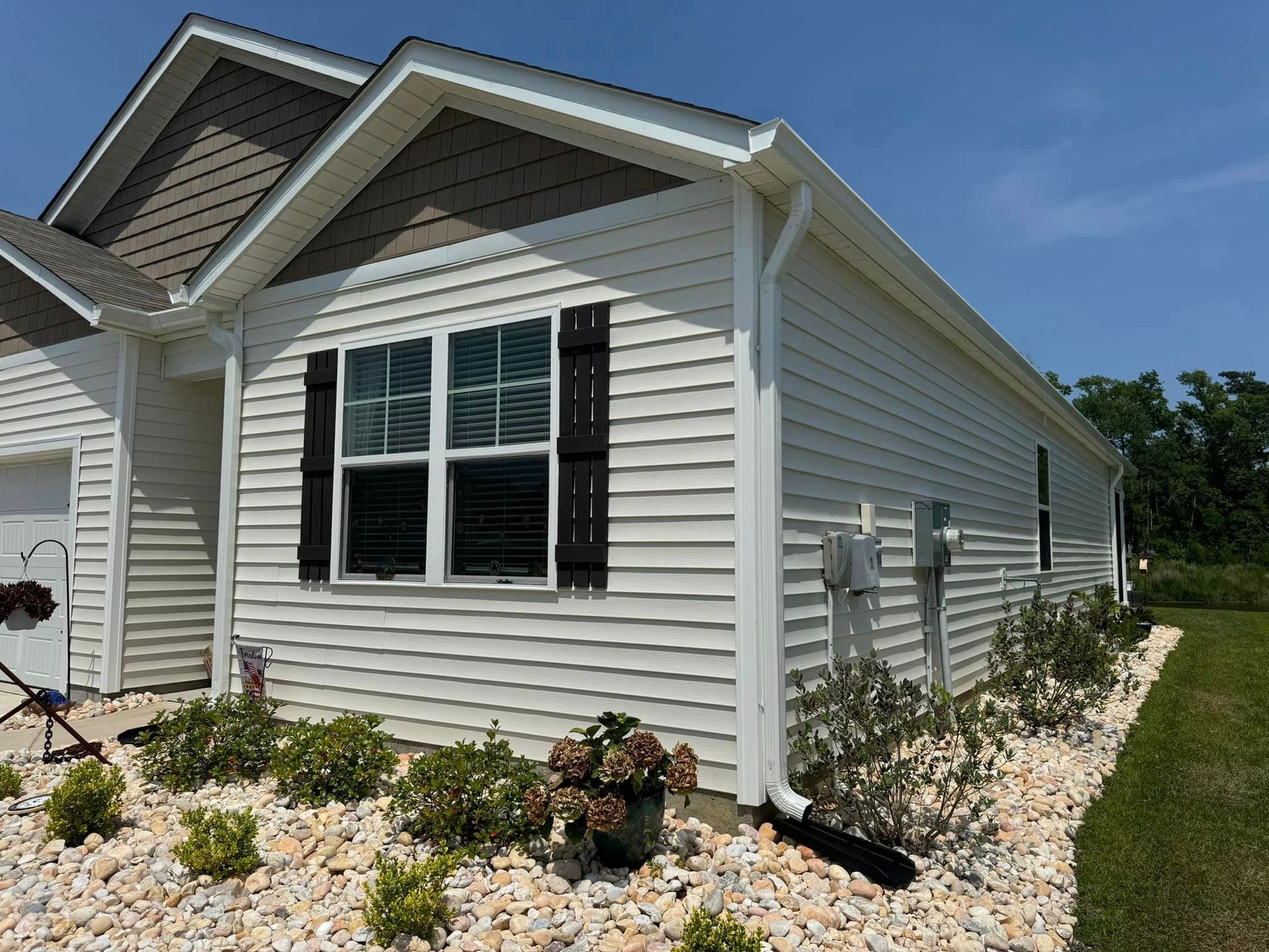 A small house with a white gutter in Mullins.