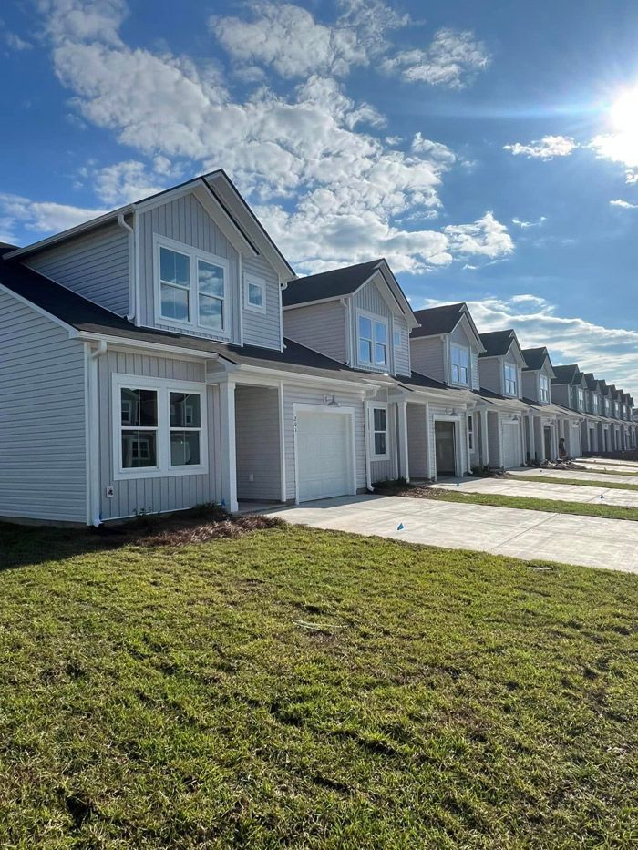 a set of condos with gutters on the front of it installed by SNL Seamless Gutters
