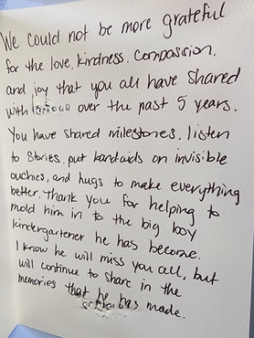 Handwritten thank-you note on white paper with dark ink, expressing gratitude and support.