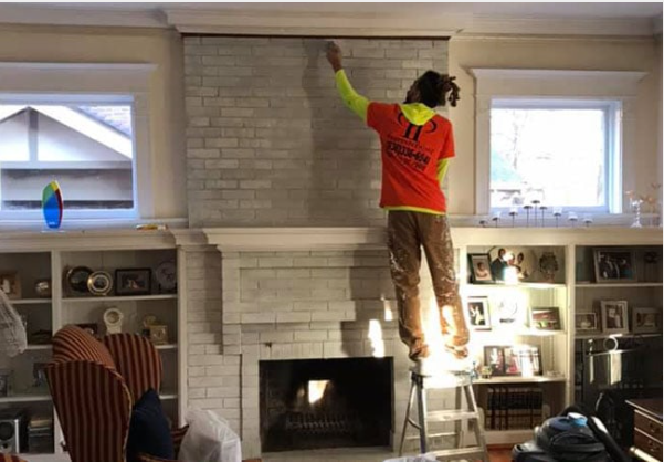 A Person Is Painting A Wall With A Brush | St. Louis, MO | PrettyNPaint