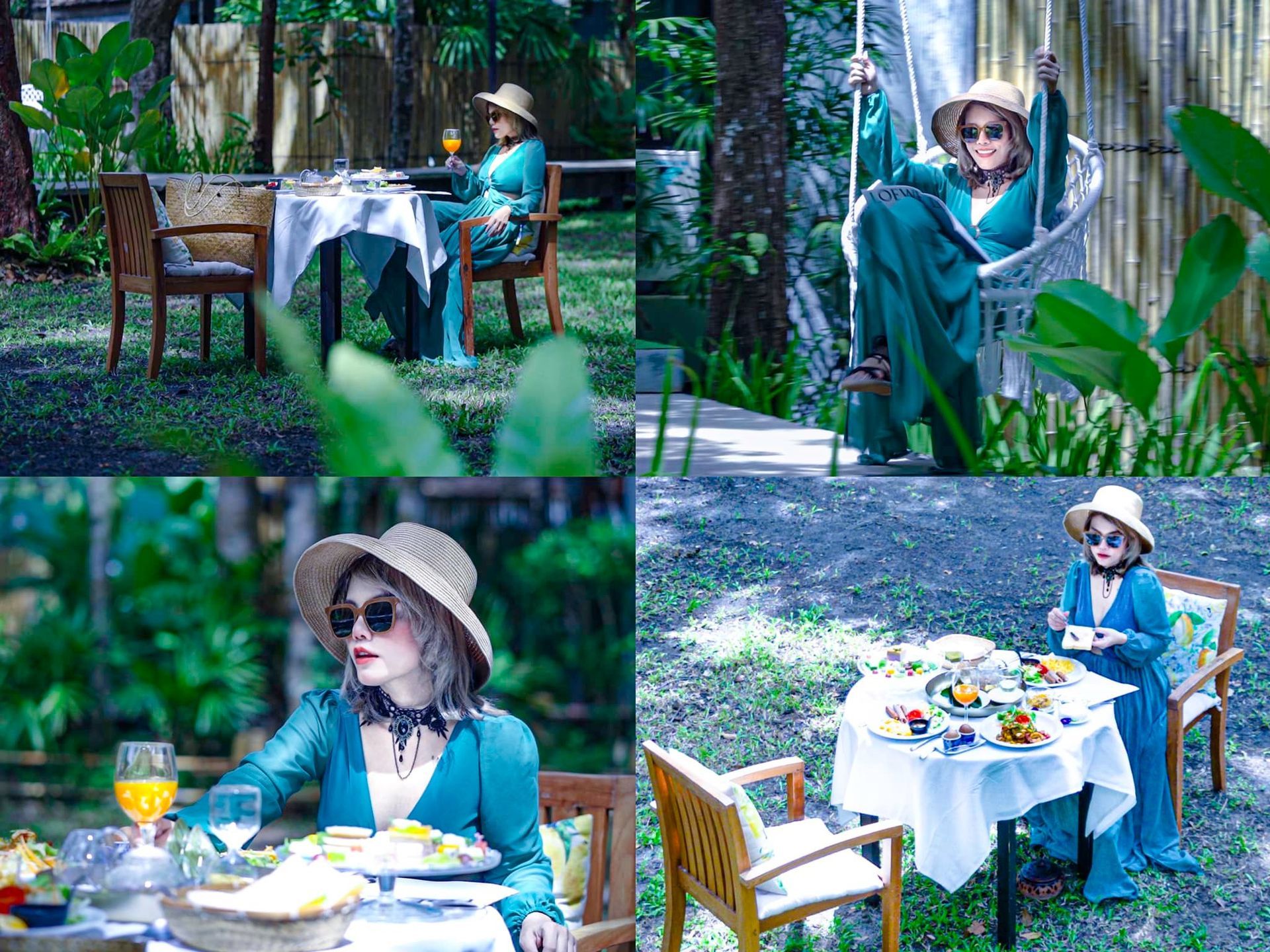 A woman in a blue dress is sitting at a table in the woods.