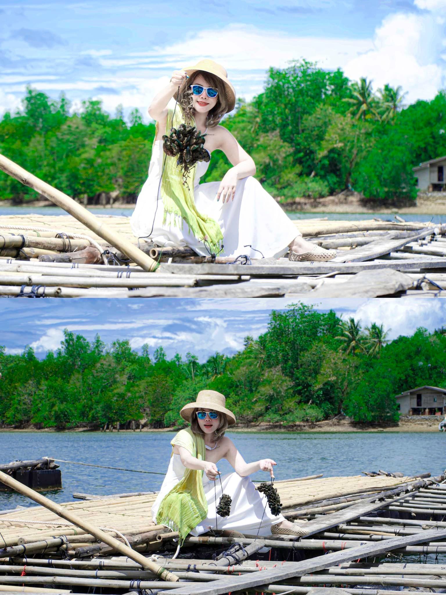 A woman is sitting on a raft in the water.