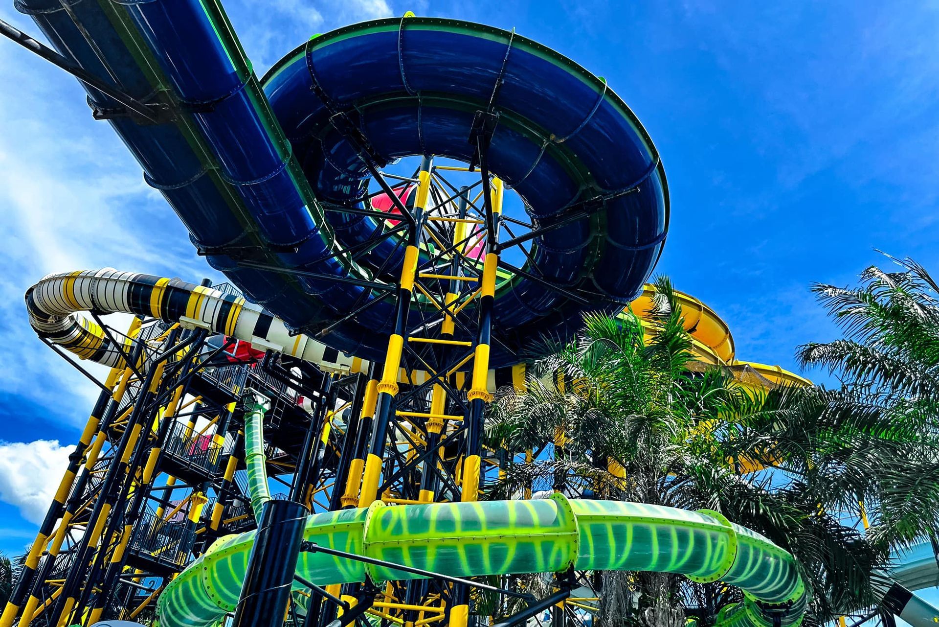 A person is riding a water slide at a water park.