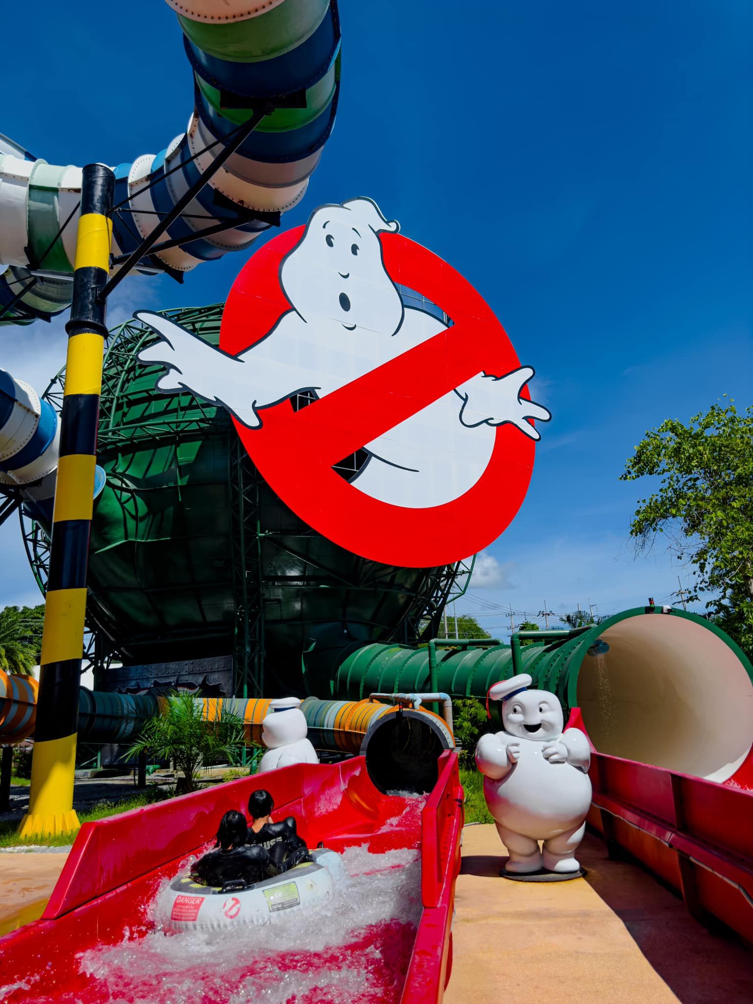 A water park with a ghostbusters sign in the background