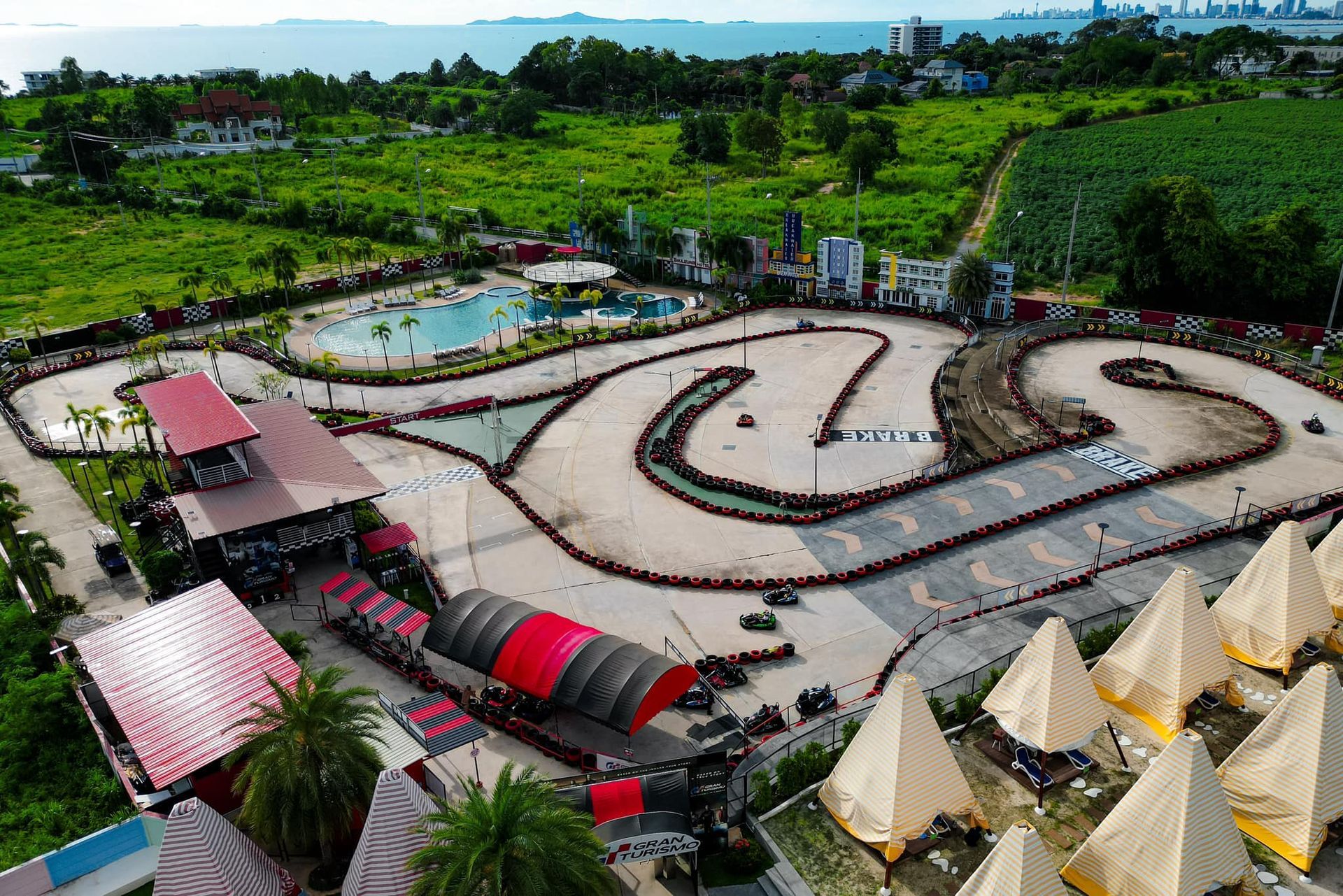 An aerial view of a go kart track surrounded by tents.
