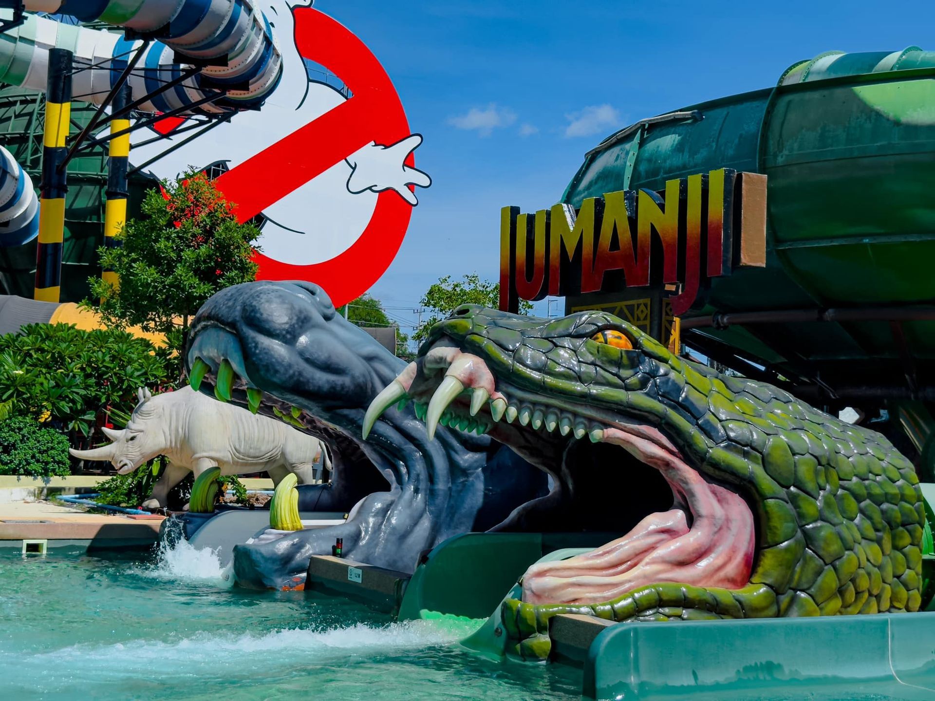 A water slide with a ghostbusters sign in the background