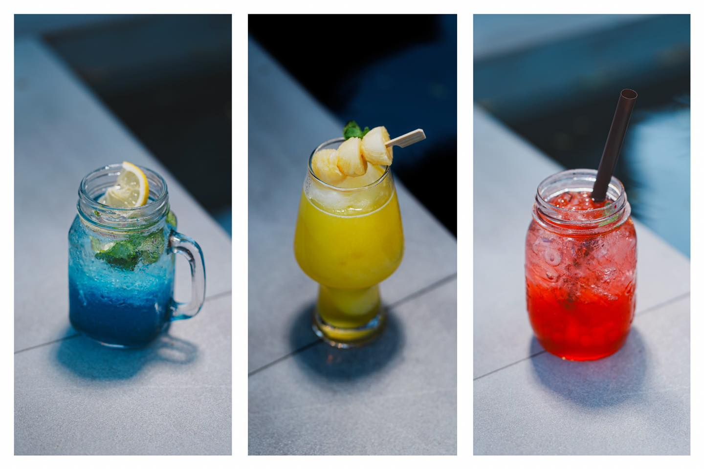 Three different drinks in mason jars are sitting on a table.