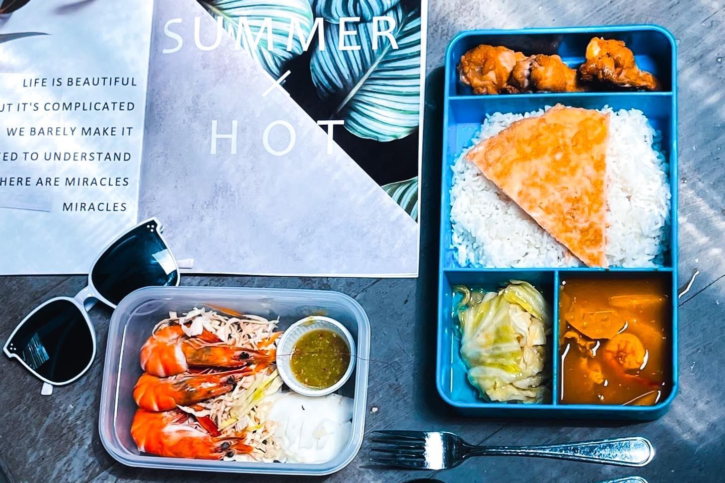 A tray of food is sitting on a table Provided by Seastar.