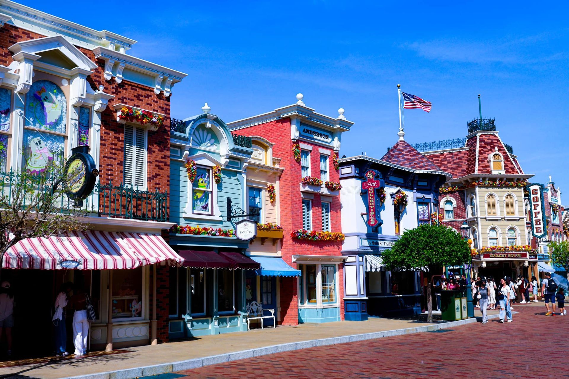 A row of buildings with a flag on top of one of them