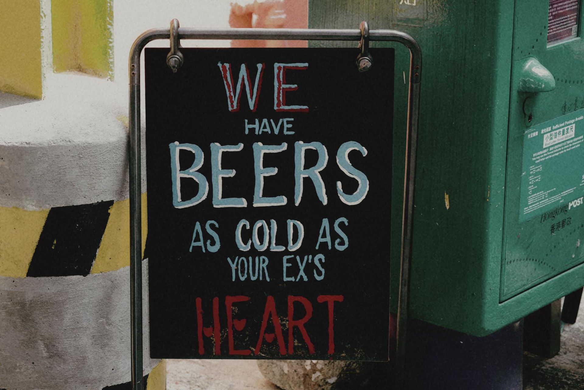 A sign that says we have beers as cold as your ex 's heart