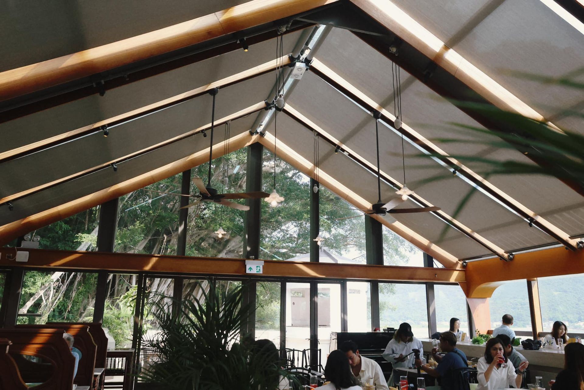 A group of people are sitting at tables in a restaurant